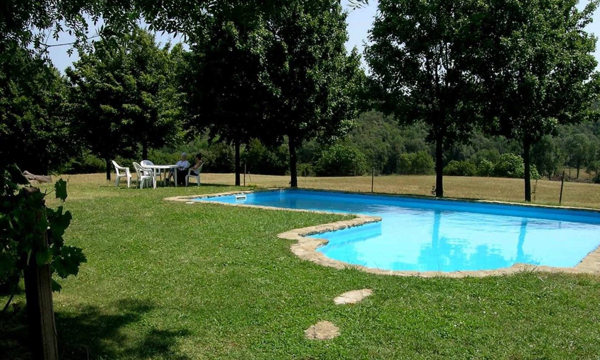 Santa Pau Apartment | Apartment 'Mas El Carrer - Verd' with Shared Pool, Shared Garden and Wi-Fi