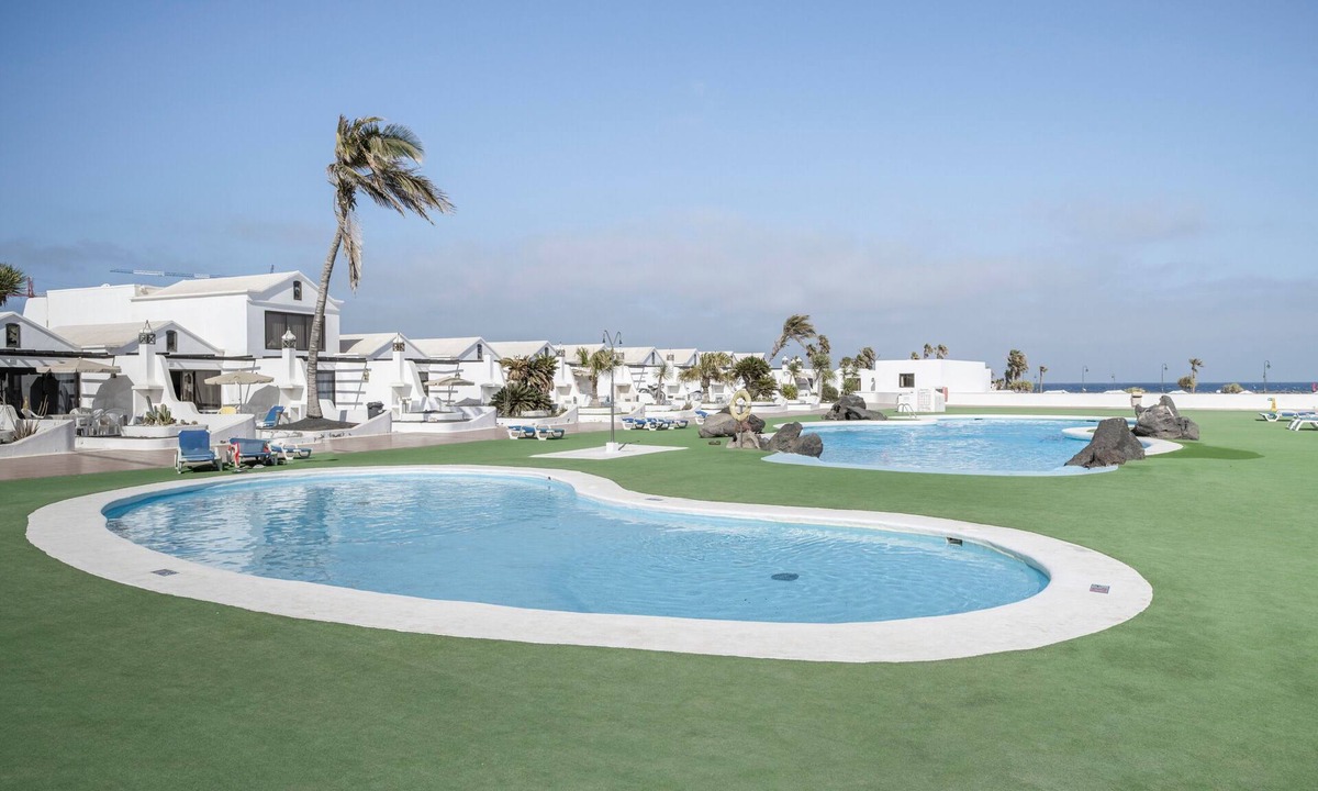 Costa Teguise Apartment | Vacation Apartment 'Amarilla 2' with Shared Pool, Private Terrace and Wi-Fi
