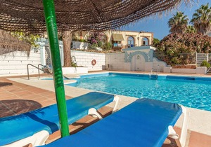 Welcome to this beautiful, family-friendly vacation home with panoramic views and shared pool.