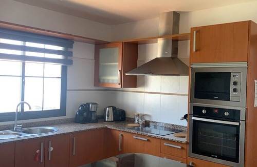 Caleta de Fuste Villa | Lovely villa - all day sun, heated private pool with golf views, close to beach