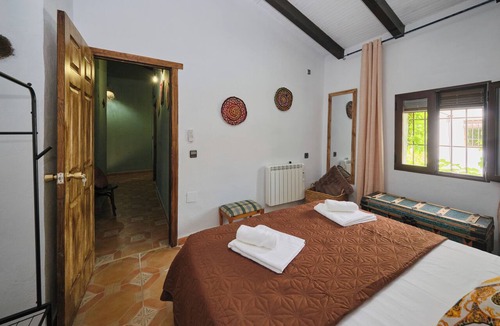 Arenas del Rey Bed & Breakfast | Luxury bedroom at Los Retamales with a queen-size bed, Casa Mathilda