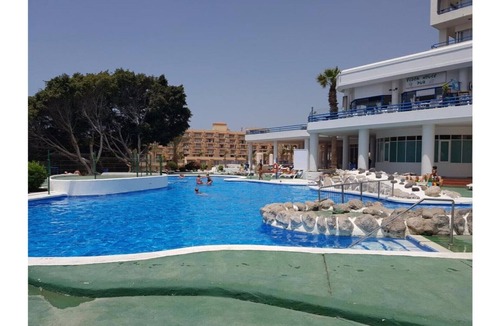 Playa Paraiso Apartment | Sea view apartment and condominium pool terrace with sunbed