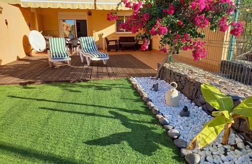 Adeje Apartment | SPACIOUS APARTMENT WITH WIFI—large terrace and flower-filled garden, sea and mountain views