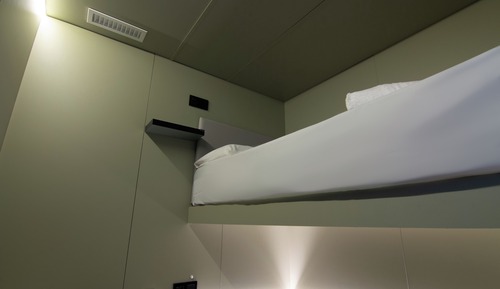Private Quad Bunk Capsule with Large Beds.