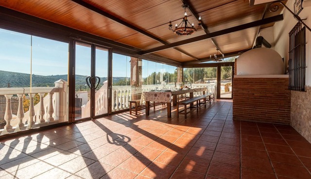 Enjoy a unique view of the countryside in this inviting vacation home with pool. in Cuevas de San Marcos