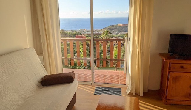 Apartment on a green finca with views of the sea and the mountains